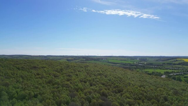 High Angle View of British Agricultural Farms at Countryside and Beautiful Landscape of Near Hills of Rotherham, England Great Britain of UK. April 30th, 2024.  Drone's Camera Footage