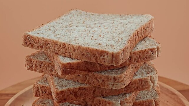 Multigrain bread sliced on wooden plate. Loaf of Bread.