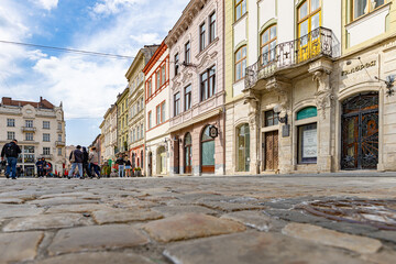 Fototapeta premium Historic Lviv Street with Cobblestone and Old Town Architecture
