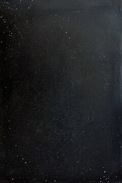 Fototapeta Abstract dark background with subtle specks of light, perfect for use in creative design projects.