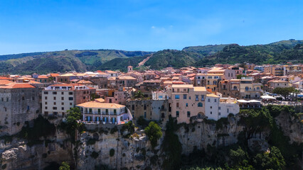 Obraz premium Aerial view of Tropea, a charming town perched on a cliff overlooking the Tyrrhenian Sea in Calabria, Southern Italy