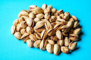 A Pile Or Group Of Healthy Salt and Pepper Pistachio Nuts In Their Shells