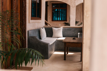 Hotel furniture, outside lounge area with corner sofa and table