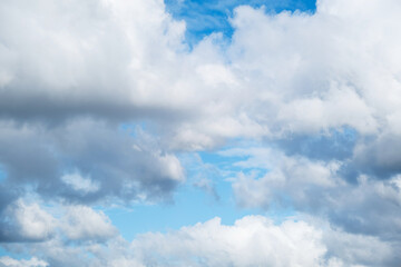 Blue Sky with Fluffy White and Grey Clouds for Natural Background. Clear Day with Open Sky and Tranquil Weather.
