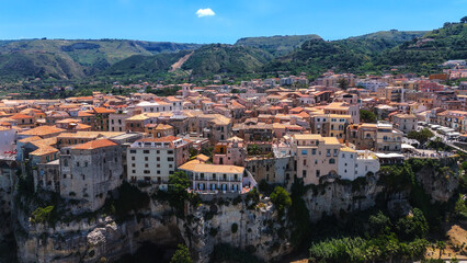 Fototapeta premium Aerial view of Tropea, a charming town in Calabria, Italy, with colorful buildings on a cliff overlooking the Tyrrhenian Sea
