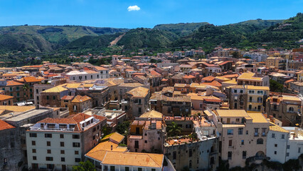 Obraz premium Aerial view of Tropea, a charming town perched on a cliff overlooking the Tyrrhenian Sea in Calabria, Southern Italy