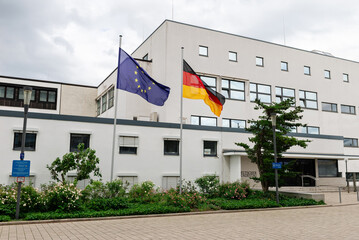 The flag of the European Union and Germany above the Bundeshaus building in Bonn, Germany