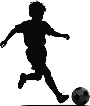 A silhouette of a young boy kicking a soccer ball with his right foot against a white background