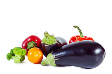 Fresh juicy ripe eggplant, yellow tomato, broccoli and bell pepper.