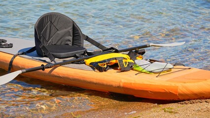 Inflatable board SUP, Stand Up Paddling surfboard for rowing. SUP prepared for watersport activities. Travelling water tourism at Lake Manitou, Manitoulin Island, Canada exploration.