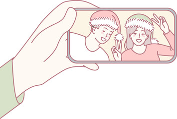 A joyful selfie that beautifully captures the joyful spirit of the holidays with friends in fun, festive hats