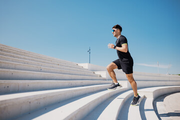 Fitness Enthusiast Conquering Outdoor Stairs in Bright Sunlight, Showcasing Determination and...