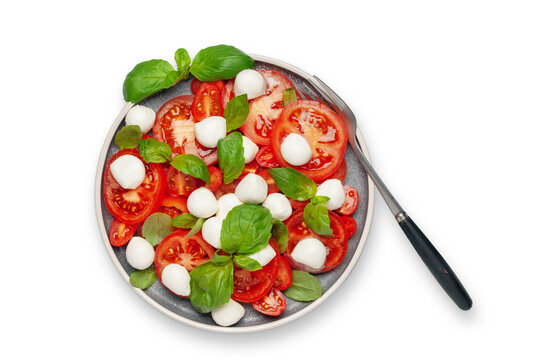 Italian caprese salad with tomatoes, mozzarella cheese and basil leaves. Top View.