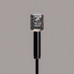 Pixelated Microphone Stands Solemnly on Grey Backdrop

