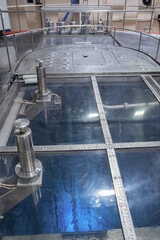 Blue glow water of nuclear reactor core powered, caused by Cherenkov radiation, fuel plates industrial uran © Parilov