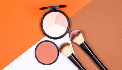 Makeup Essentials: Brushes, Compact, and Blush on Brown & White Background