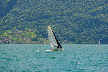 Sailboat cruising on Lake Iseo