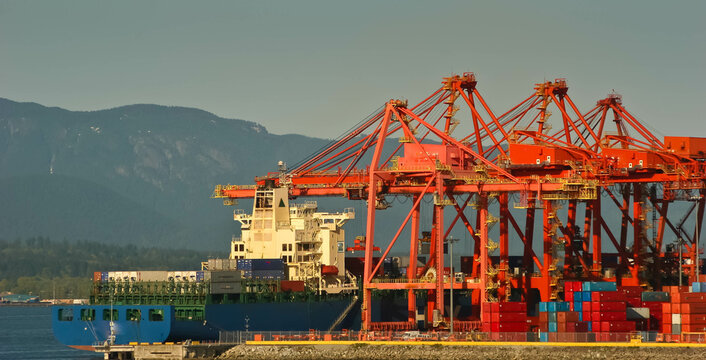 Large Gantry Crane Loading a Container Ship at Coal Harbor, Vancouver British Columbia.,CAN