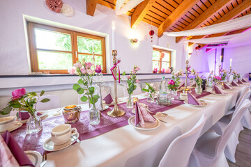 Wedding decor. Close up of a wedding table decoration with white and pink flowers and candles Wedding floristic concept