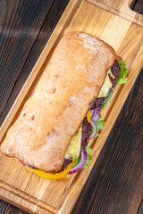 Hearty Ciabatta Sandwich Stacked With Beef Patties, Yellow Tomatoes, And Crisp Lettuce