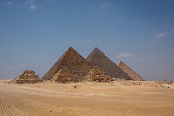 Pyramids of Giza against a clear blue sky