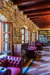  Library Interior in the Citadel, Budva, Montenegro — Bookshelves and Burgundy Chairs