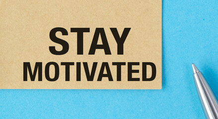 A piece of paper with the words Stay Motivated written on it