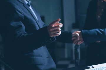 Close-up of handshake of businesswoman and businessman