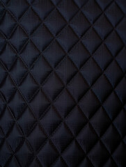 Fototapeta premium Dark blue quilted fabric texture background