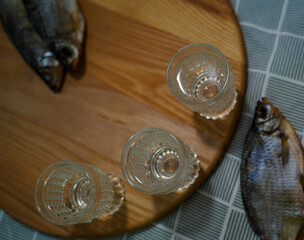 Traditional Dried Fish with Glasses of Vodka on Table