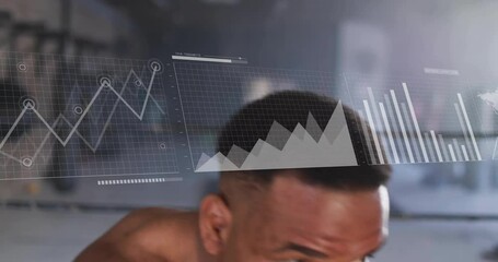 Boxer throwing jab and cross punches in boxing gym, launching sports analytics with evolving graphs - Powered by Adobe