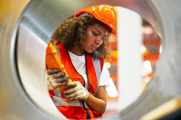 African workers working happy aftter working of maintenance machine in heavy industrial factory