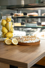homemade lemon tart with meringue and lemons