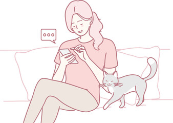 A woman enjoys her phone while a cat playfully interacts nearby, capturing warmth and companionship.