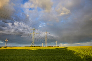 High-voltage power line in high-contrast evening light.