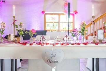Wedding decor. Close up of a wedding table decoration with white and pink flowers and candles Wedding floristic concept