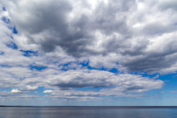 Panorama of the warm Gulf of Riga of the Baltic Sea against the background of cumulus clouds. The...