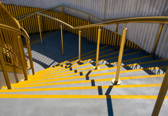  Yellow edged stone steps decending to a underpass