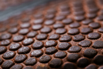 Detailed Close-up detail macro shot of a textured leather dark orange basketball on a white background. Sports Equipment. Sport and Game concept.