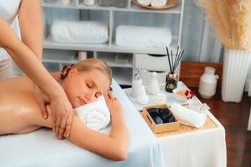 Caucasian woman customer enjoying relaxing anti-stress spa massage and pampering with beauty skin...
