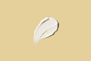 Cosmetic smear of cream texture on pastel yellow background. Skin care.
