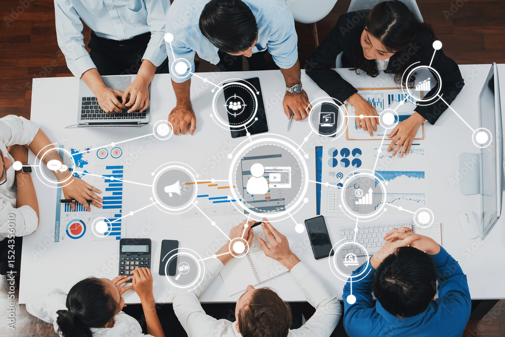 Poster A dynamic marketing strategy session featuring professionals analyzing data and collaborating on innovative solutions using digital communication tools in a modern office setting. Amity