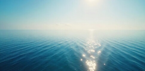 Vast, endless ocean meeting the hazy horizon line Sunlight glints on the calm water, creating a serene and peaceful atmosphere Perfect for travel, nature, or tranquility themes , waterfront, sun