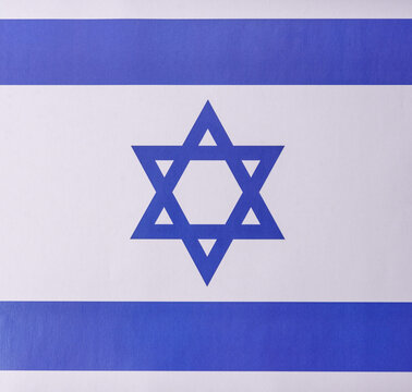 Israeli flag in white and blue colors as a symbol of independence. Flag of Israel