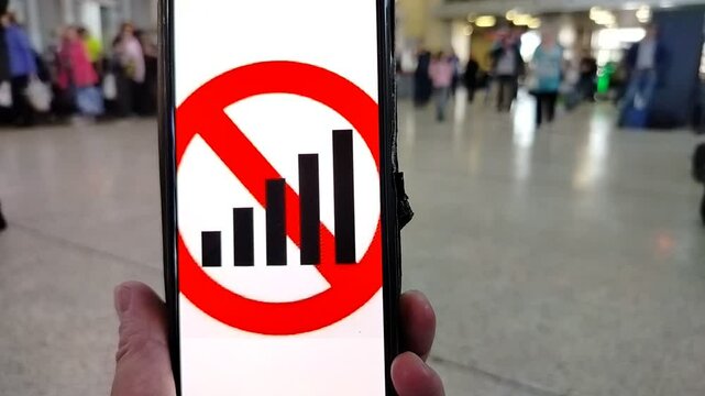 A person has problems with the signal on his phone where there are many people in the city