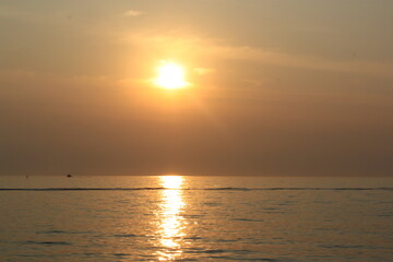 the shimmer of the sea at sunset