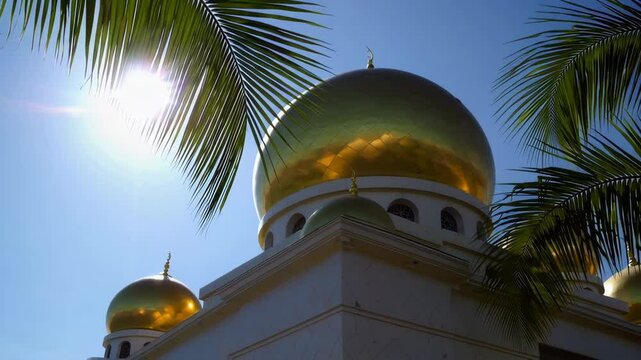 Golden domes of sultan omar ali saifuddin mosque glistening under tropical sun