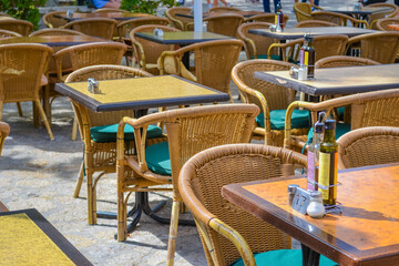Close-Up of Rattan Table and Chairs at Outdoor Restaurant Patio