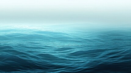 Fototapeta premium Serene expanse of oceanic waves, fading into a misty horizon ambiance