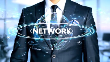 Businessman interacting with a holographic Earth and the word network symbolizing global connectivity, data flow, and international business relations in a modern office